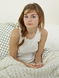 UhTeens presents: Sweet teen brunette stripping naked in the bed