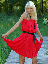 UhTeens presents: Naughty teen appears in her sexy red dress and starts removing it passionately and moving slowly.